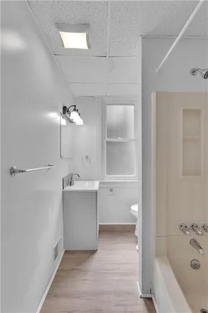 a bathroom with a bathtub and a toilet
