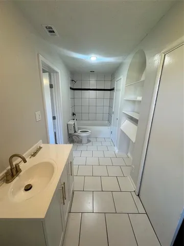 a view of hall way with furniture