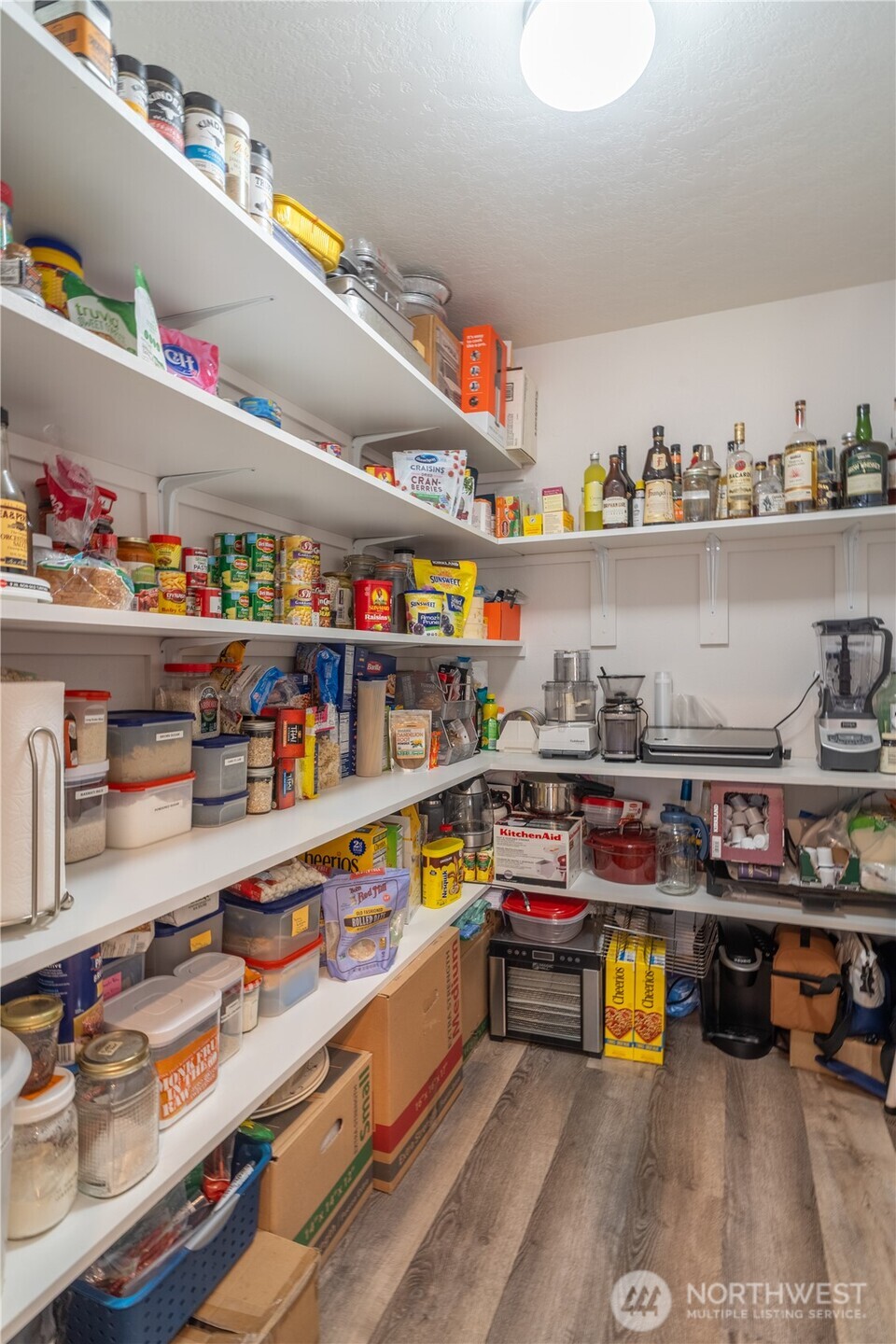1630 Filmore Drive Moses Lake, WA 98837 - Photo 13 of 40 a kitchen with lots of clutter and stainless steel appliances