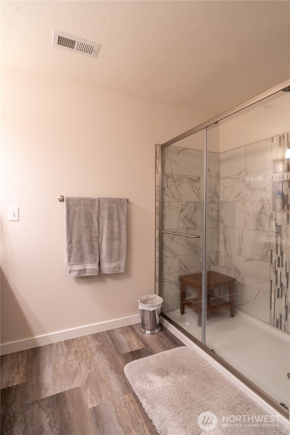 1630 Filmore Drive Moses Lake, WA 98837 - Photo 27 of 40 a bathroom with a granite countertop sink a mirror and shower