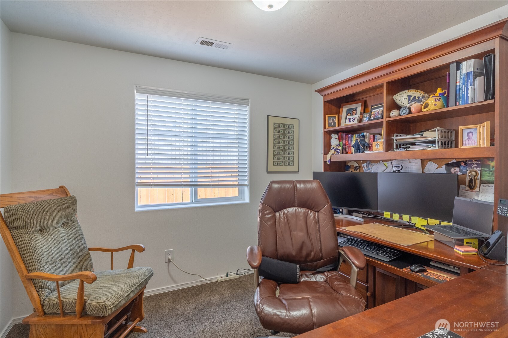 1630 Filmore Drive Moses Lake, WA 98837 - Photo 29 of 40 a living room with furniture fireplace and book shelf