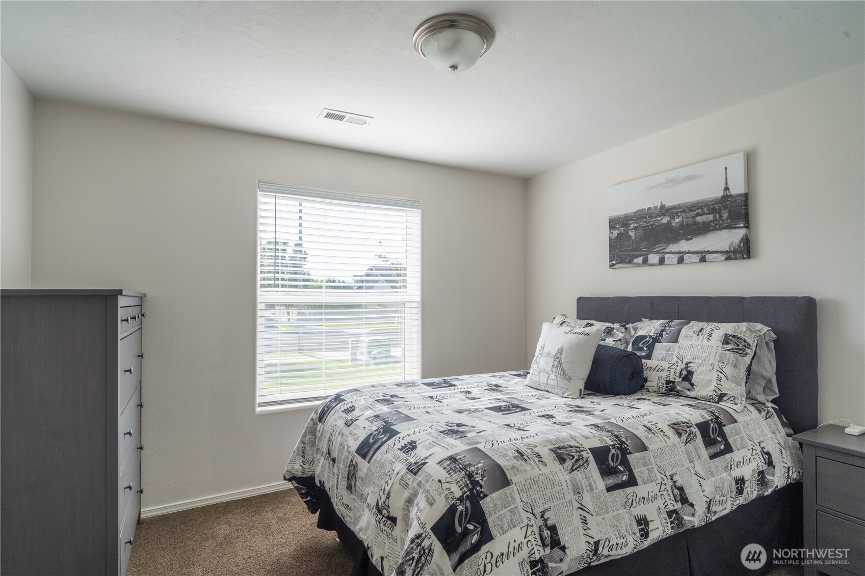 1630 Filmore Drive Moses Lake, WA 98837 - Photo 32 of 40 a bedroom with a large bed and a window