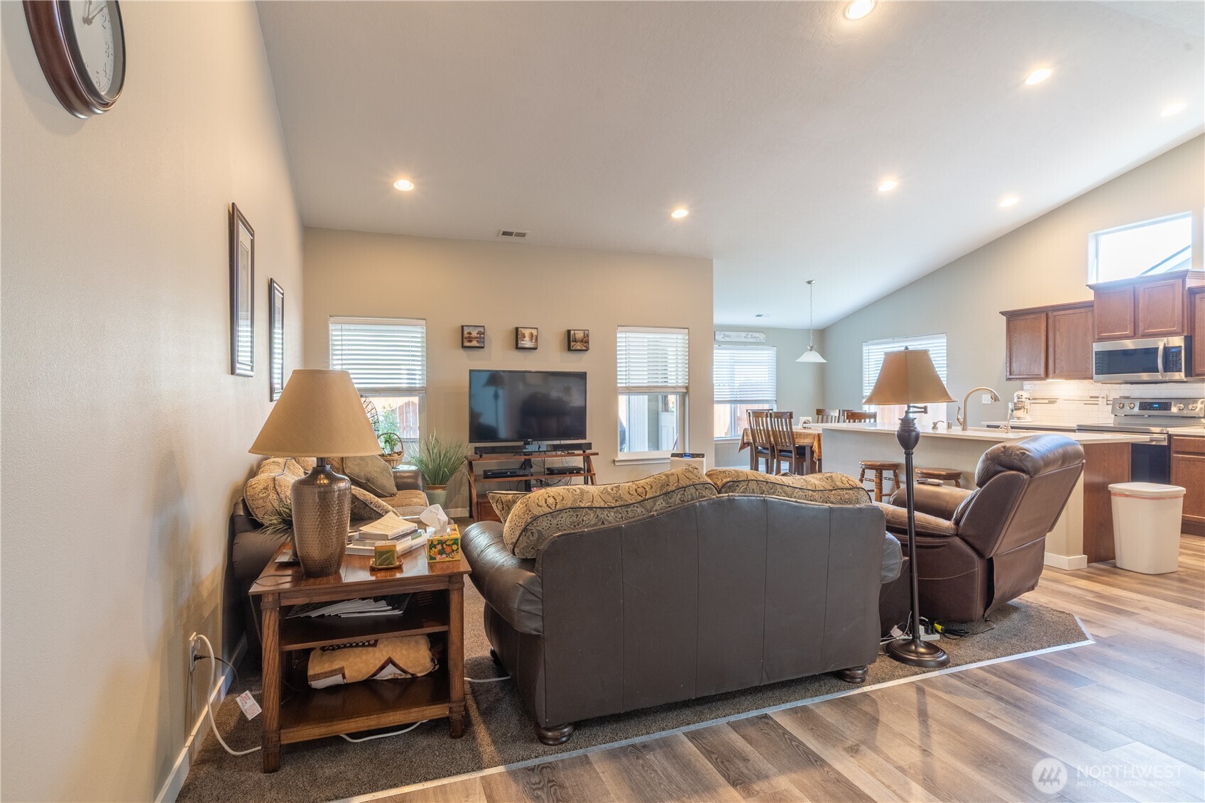 1630 Filmore Drive Moses Lake, WA 98837 - Photo 4 of 40 a living room with furniture a fireplace and a flat screen tv