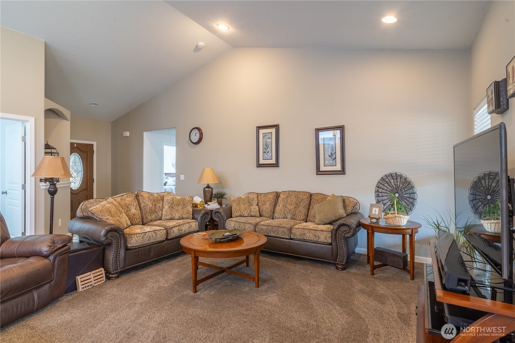 1630 Filmore Drive Moses Lake, WA 98837 - Photo 6 of 40 a living room with furniture a couch and a flat screen tv