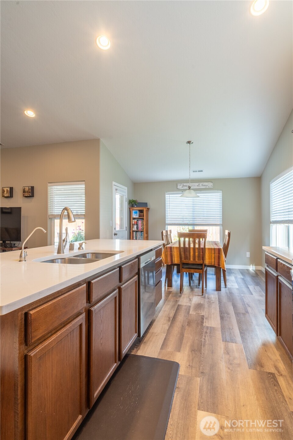 1630 Filmore Drive Moses Lake, WA 98837 - Photo 9 of 40 a kitchen with a sink dining table and chairs