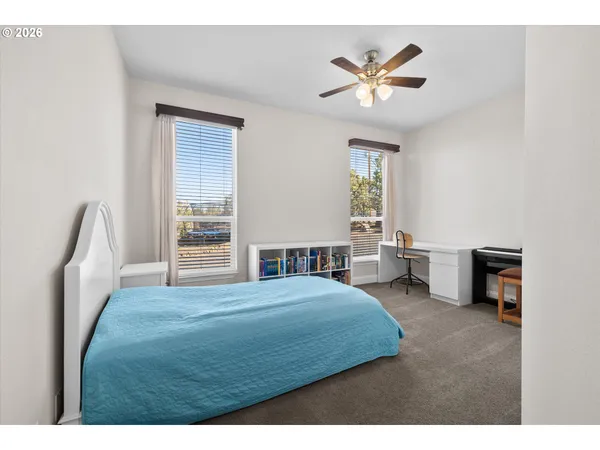 a bedroom with a bed furniture and a window