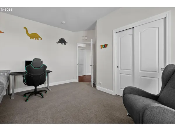 a view of a livingroom with workspace and a couch