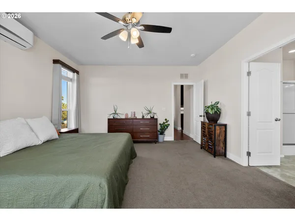a bed room with a bed and a chandelier