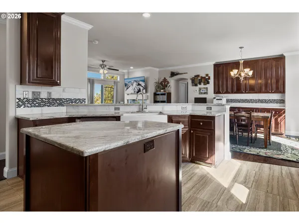 a open kitchen with a stove and a sink