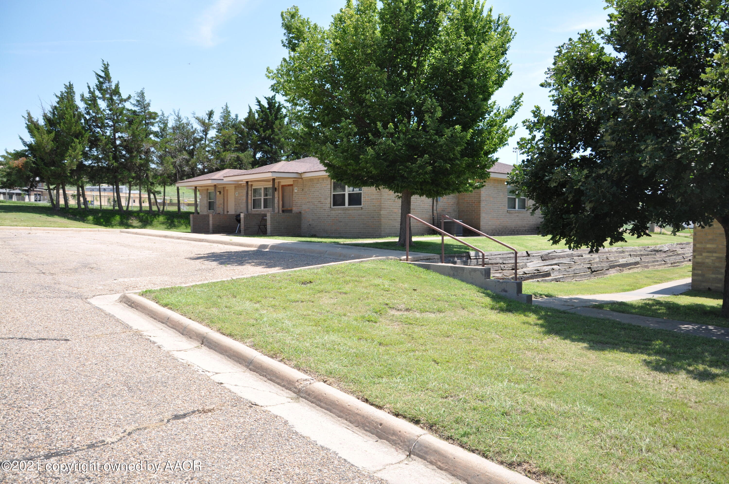 401 Mesa View Miami, TX 79059 - Photo 2 of 26 a swimming pool with some trees in the background