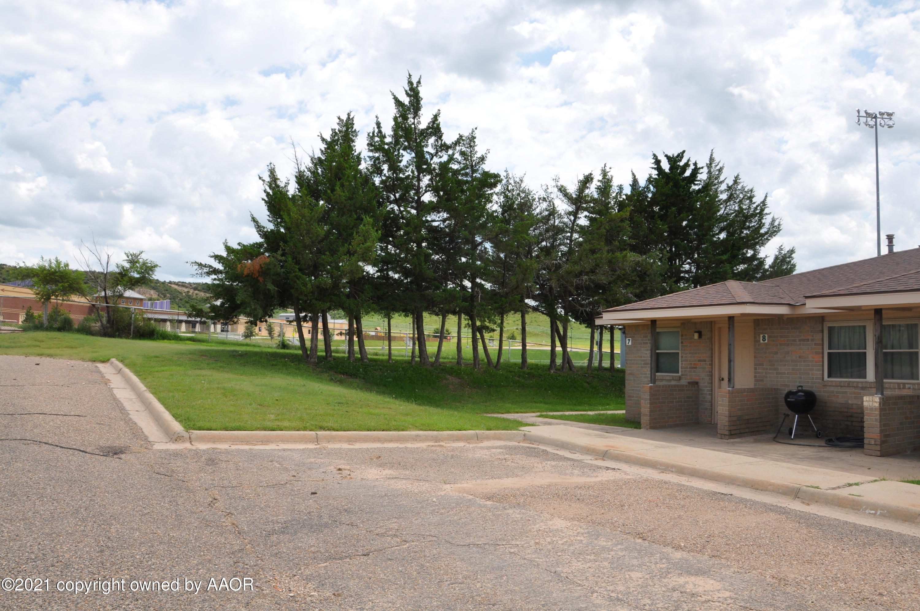 401 Mesa View Miami, TX 79059 - Photo 24 of 26 a view of a house with a garden