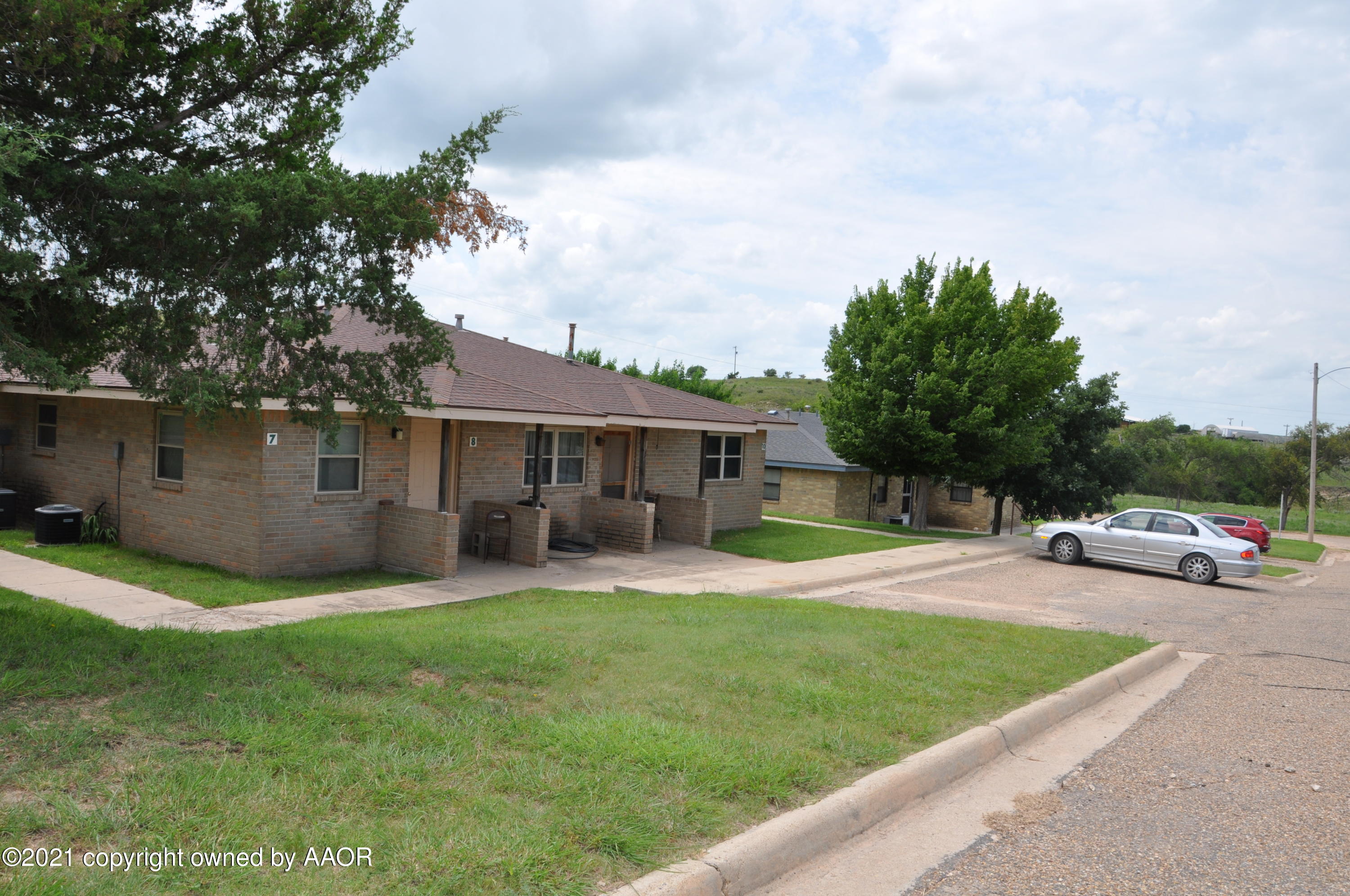 401 Mesa View Miami, TX 79059 - Photo 25 of 26 a view of a house with a yard and sitting area