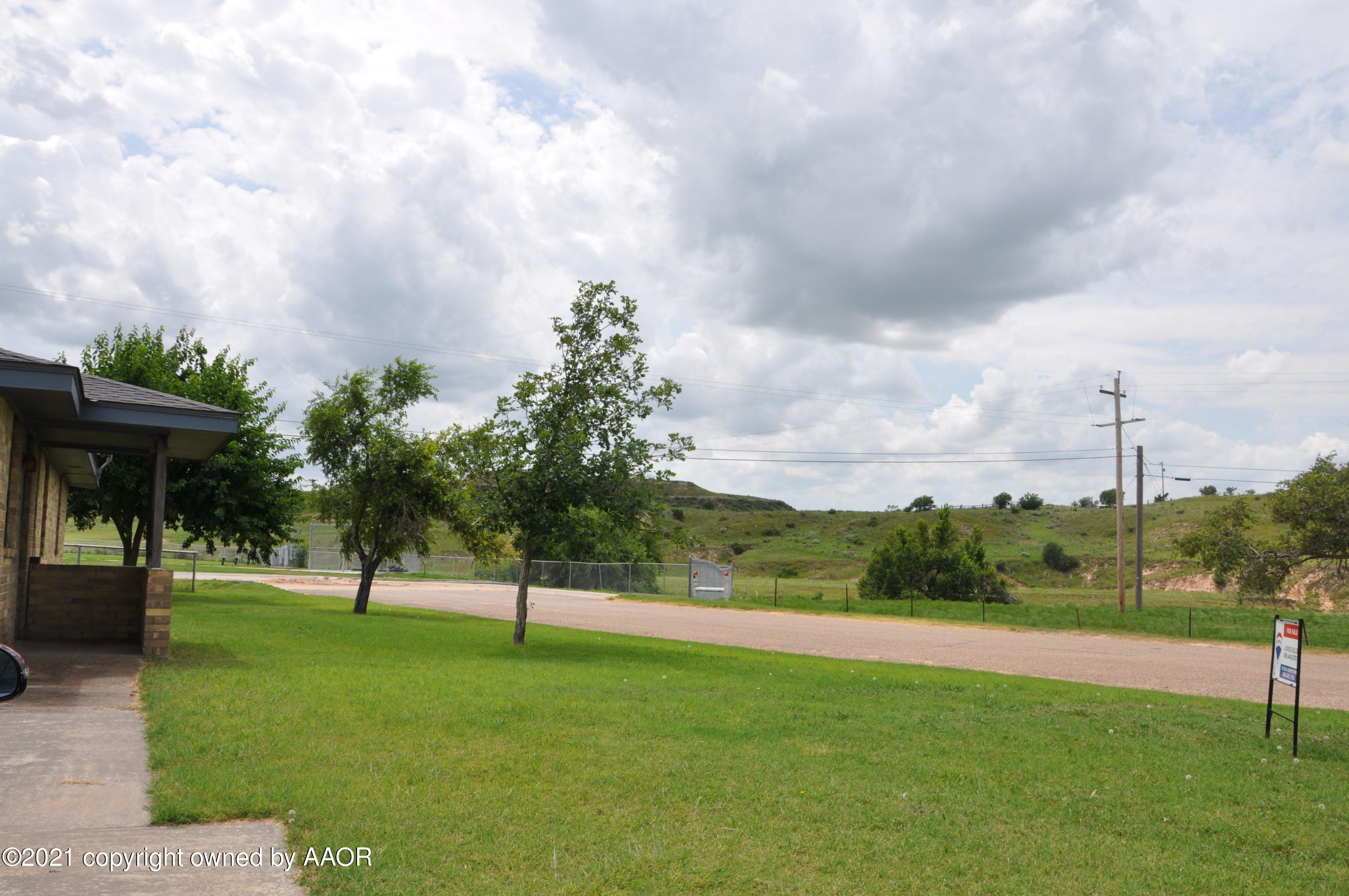 401 Mesa View Miami, TX 79059 - Photo 26 of 26 a view of a park with swings and slides