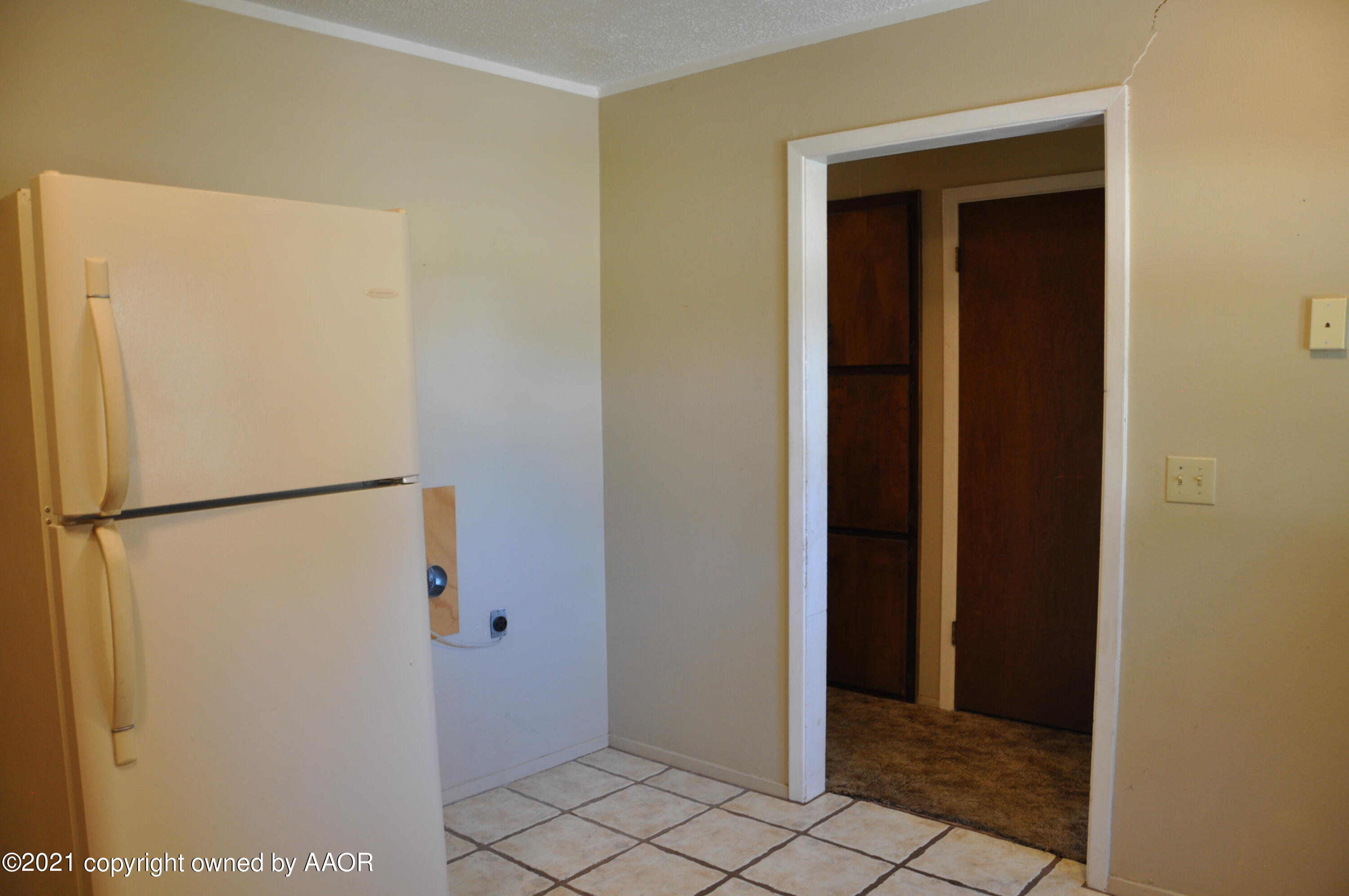 401 Mesa View Miami, TX 79059 - Photo 7 of 26 a view of a refrigerator in kitchen