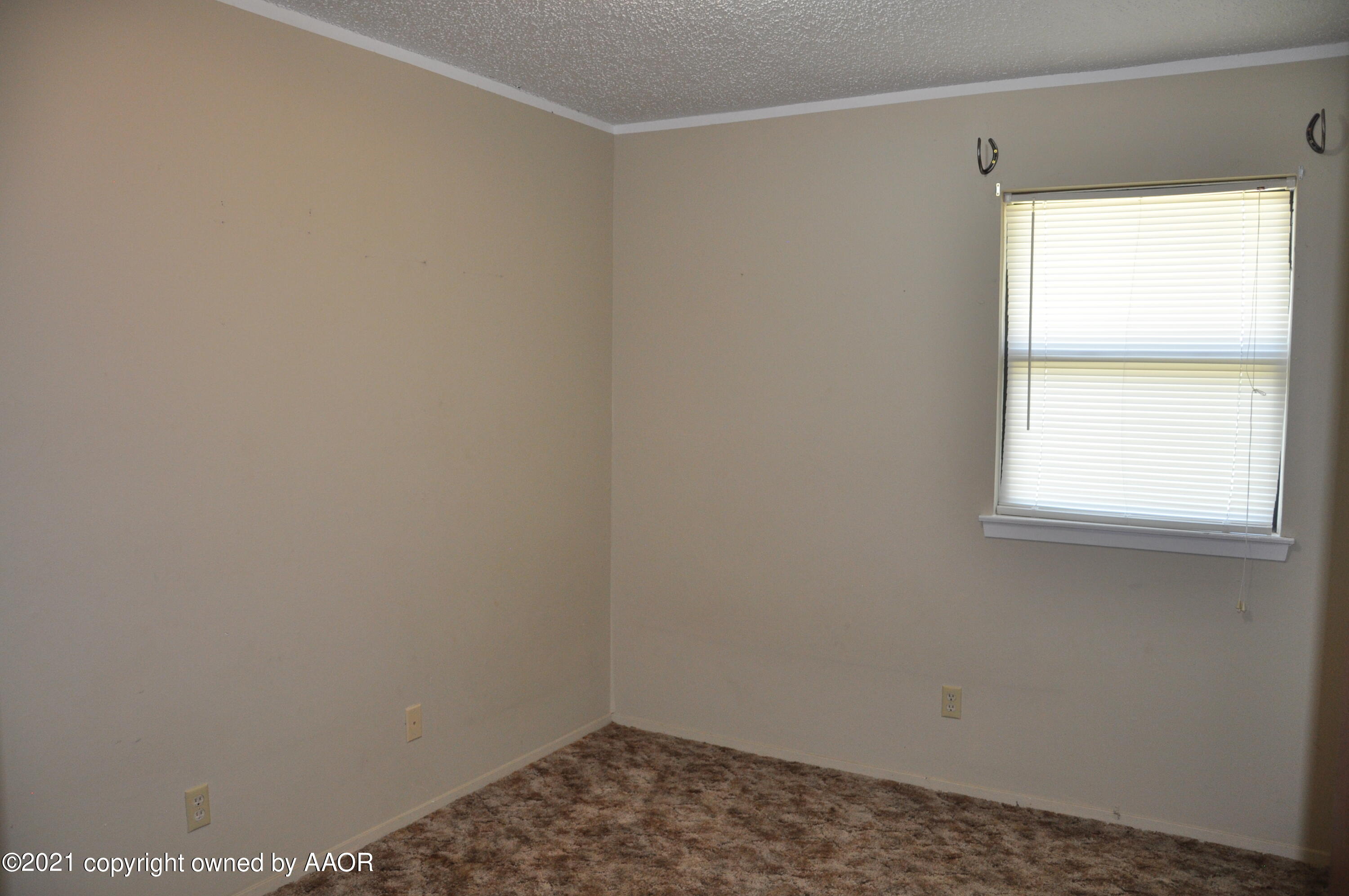 401 Mesa View Miami, TX 79059 - Photo 9 of 26 a small space with a window