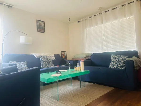 a living room with furniture and a rug