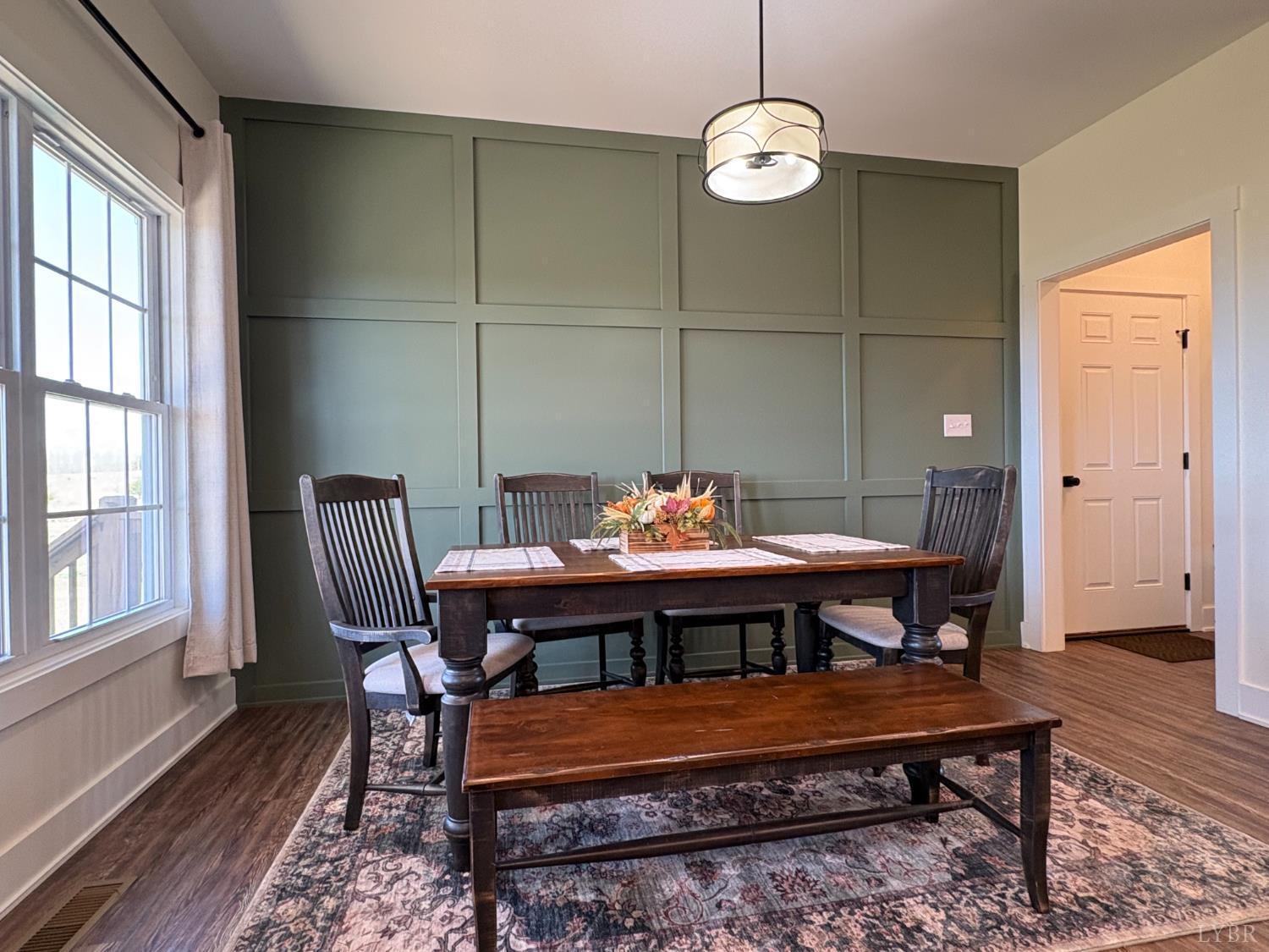 2142 Clarks Road Rustburg, VA 24588 - Photo 13 of 70 a view of a dining room with furniture window and wooden floor