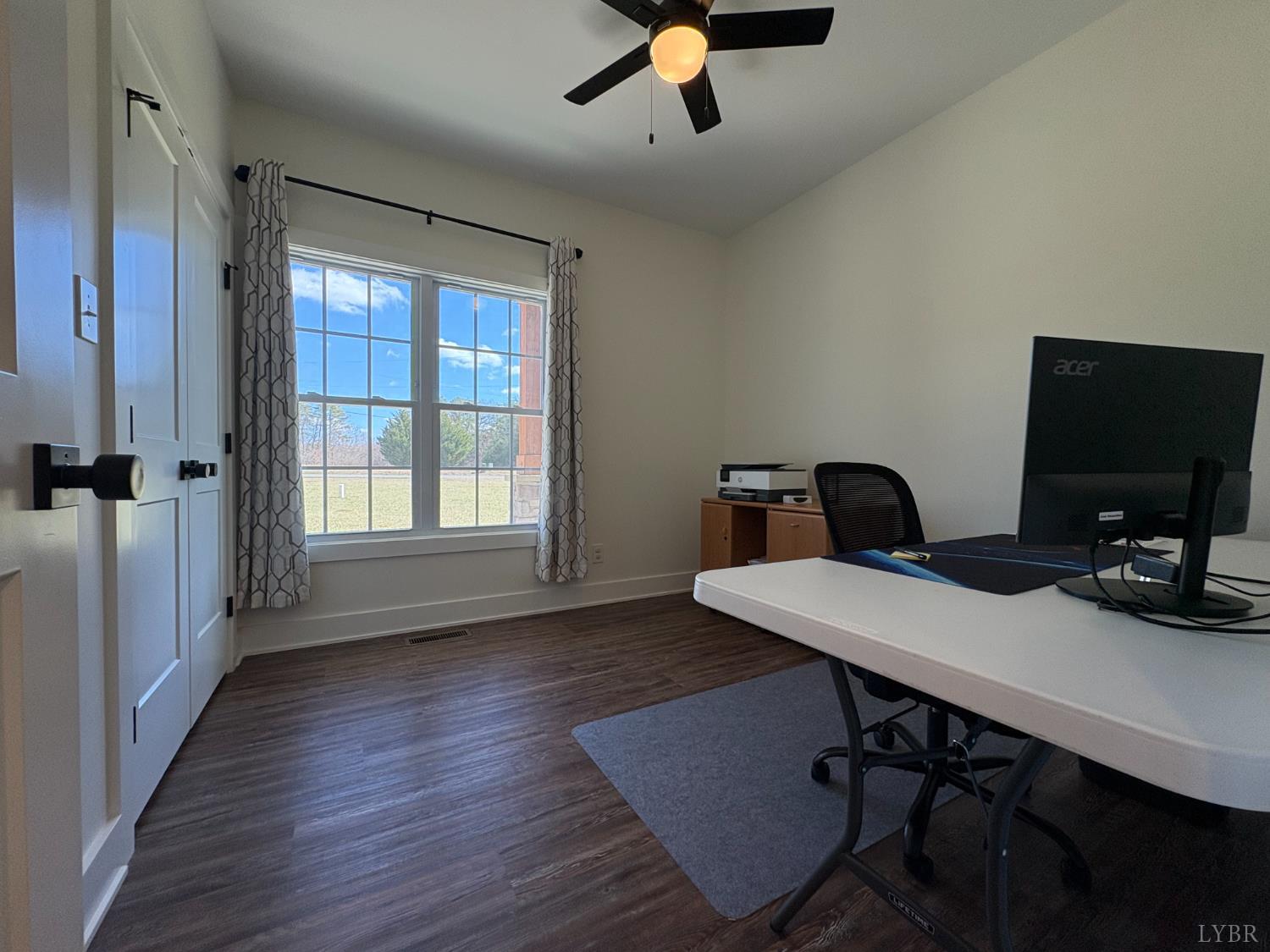 2142 Clarks Road Rustburg, VA 24588 - Photo 27 of 70 a view of a workspace with furniture and a window