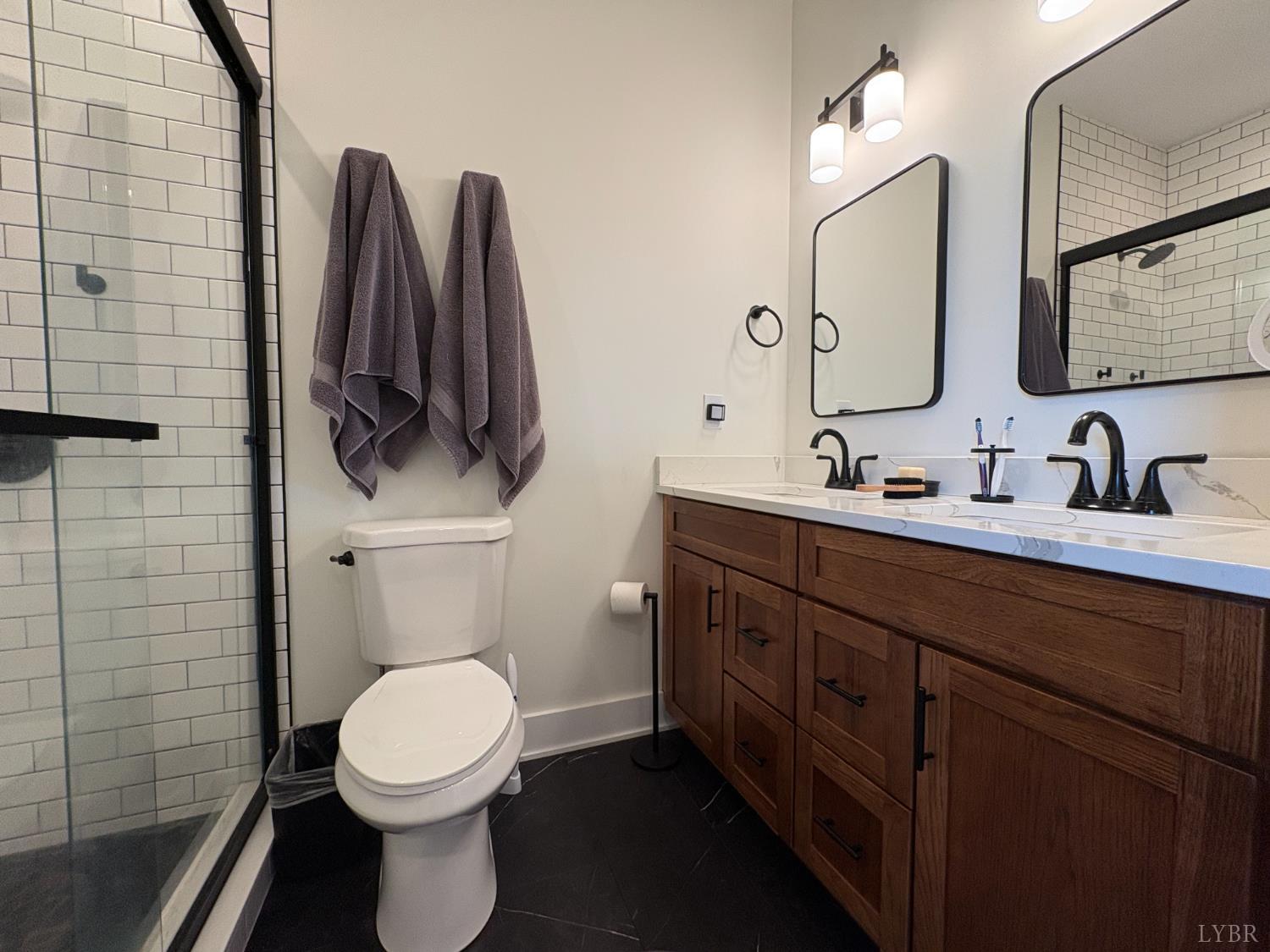 2142 Clarks Road Rustburg, VA 24588 - Photo 38 of 70 a bathroom with a toilet sink and mirror