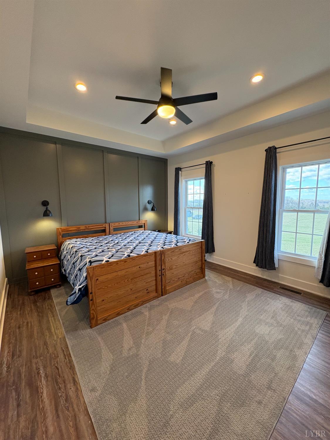 2142 Clarks Road Rustburg, VA 24588 - Photo 41 of 70 a bedroom with a large bed and a chandelier