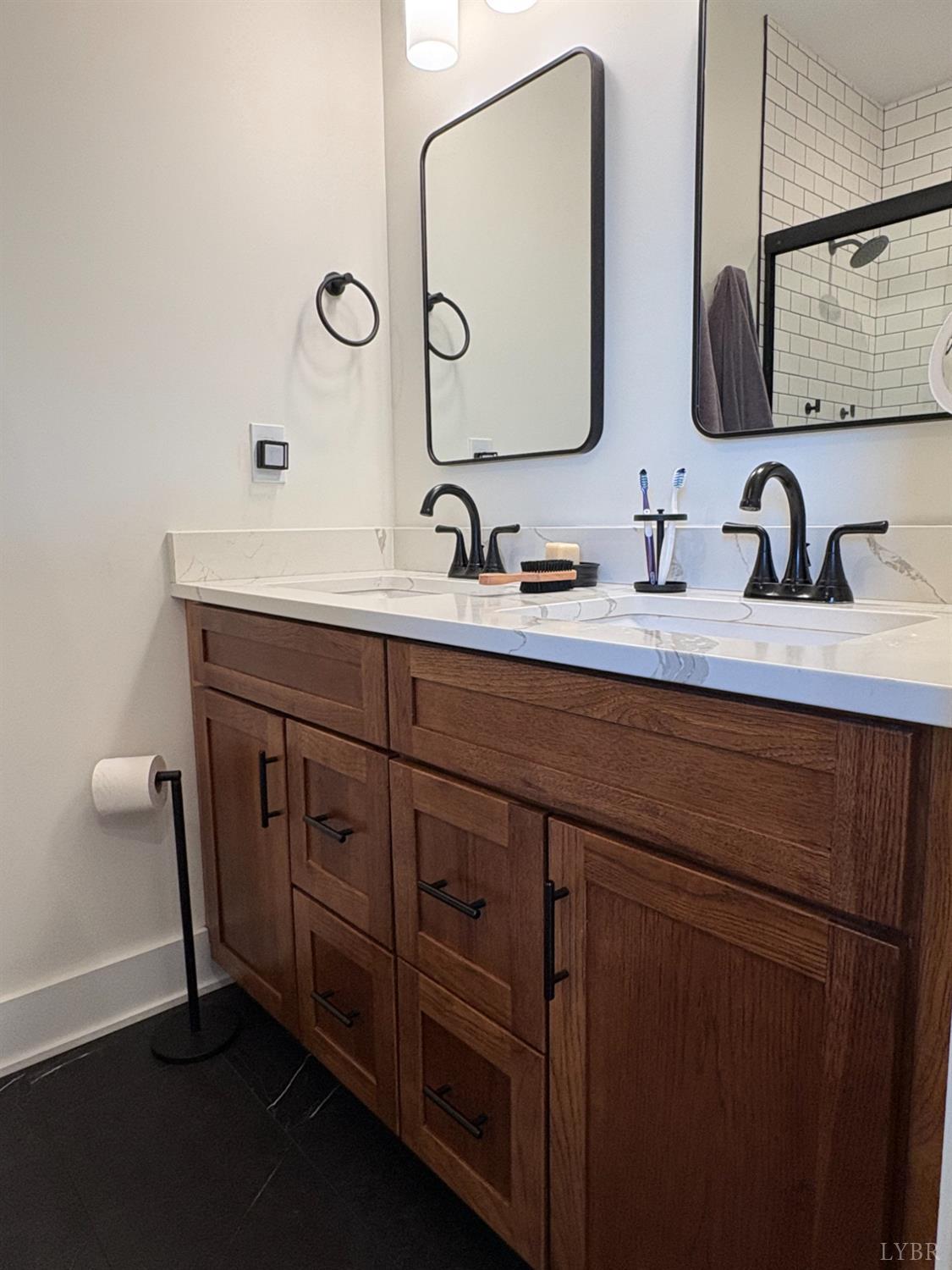 2142 Clarks Road Rustburg, VA 24588 - Photo 47 of 70 a bathroom with double sink and a mirror