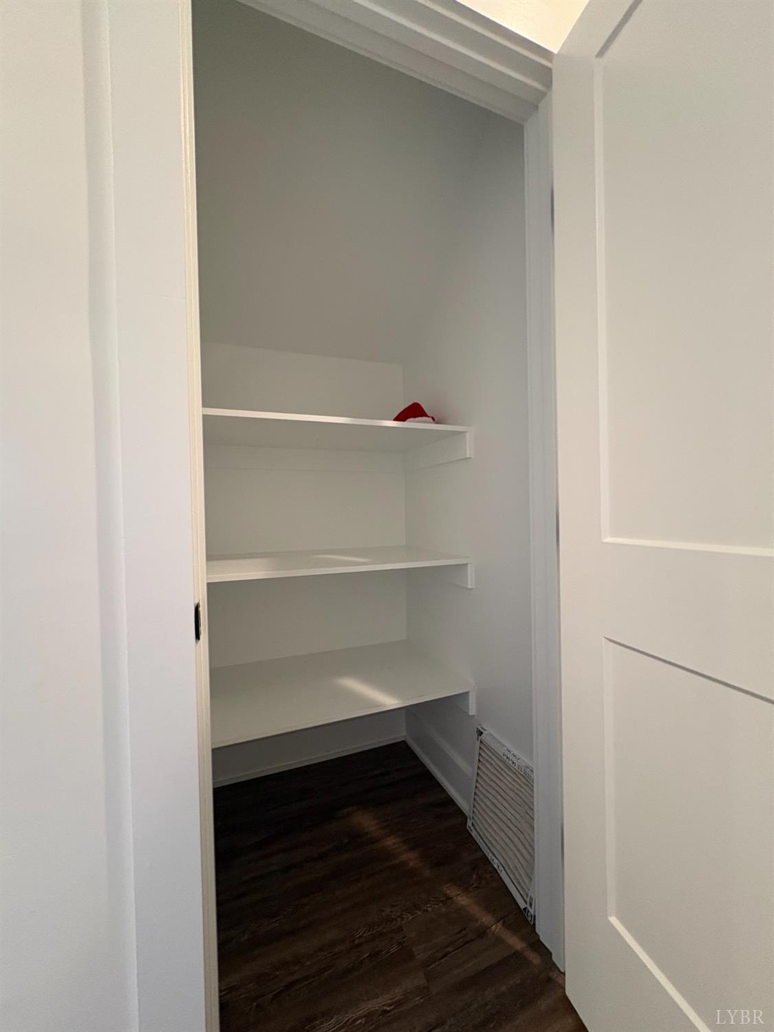 2142 Clarks Road Rustburg, VA 24588 - Photo 51 of 70 a view of walk in closet with empty racks