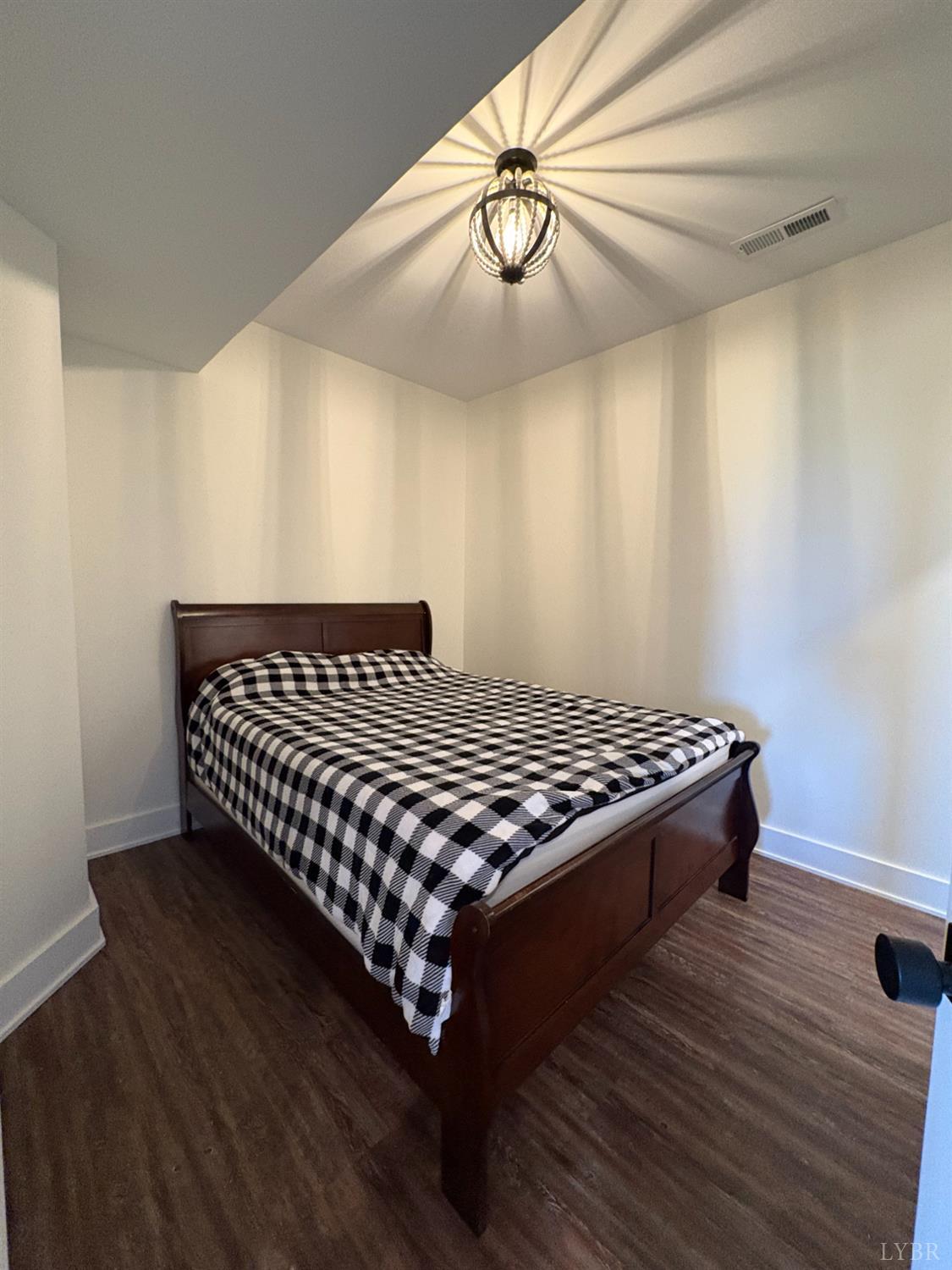 2142 Clarks Road Rustburg, VA 24588 - Photo 55 of 70 a bedroom with a bed and wooden floor