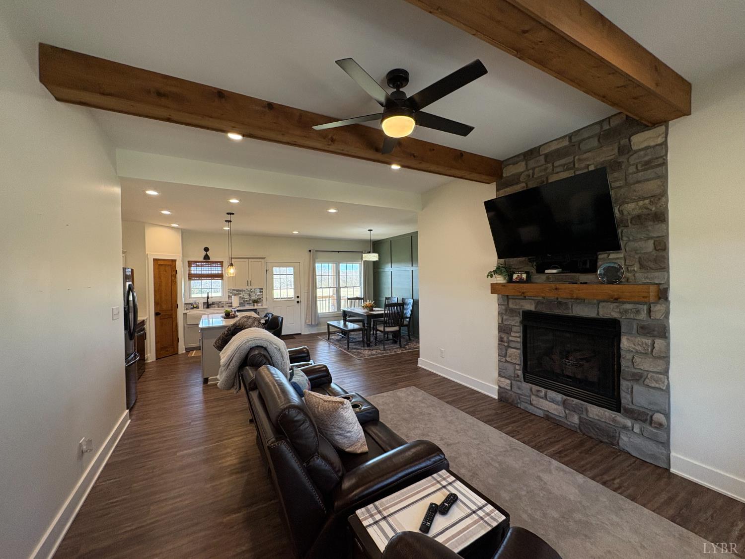 2142 Clarks Road Rustburg, VA 24588 - Photo 7 of 70 a living room with furniture a flat screen tv and a fireplace
