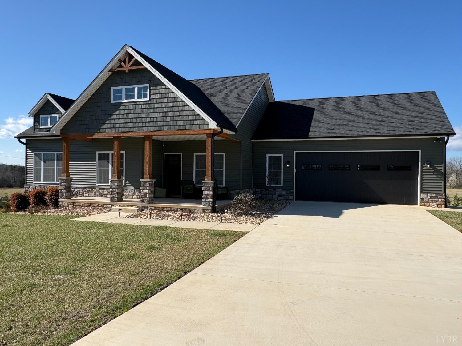 2142 Clarks Road Rustburg, VA 24588 - Photo 10 of 70 a front view of a house with swimming pool and a garden