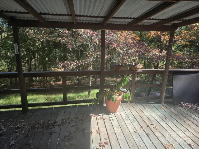 a view of a porch with wooden floor