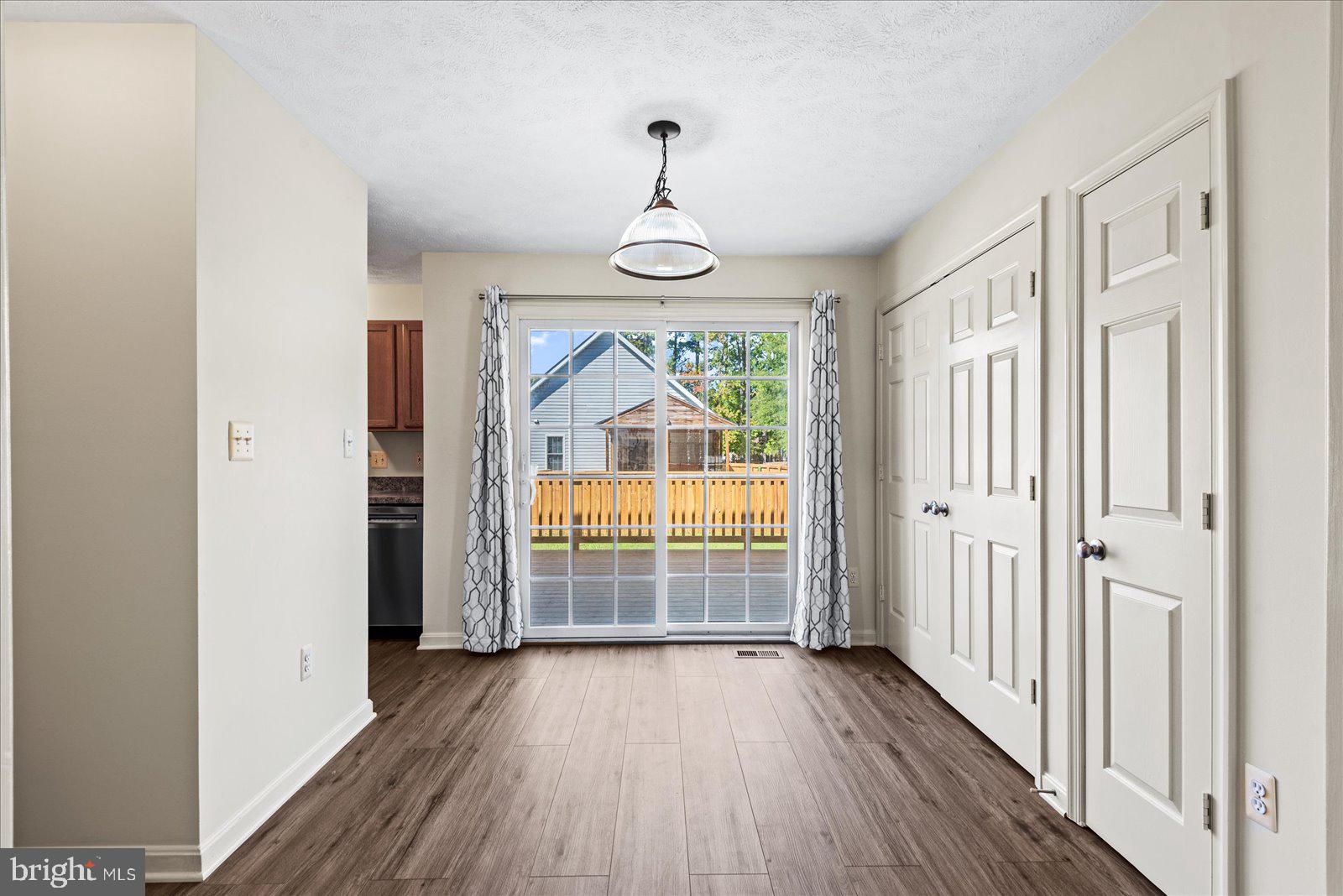 321 3rd Street Colonial Beach, VA 22443 - Photo 11 of 47 a view of empty room with wooden floor