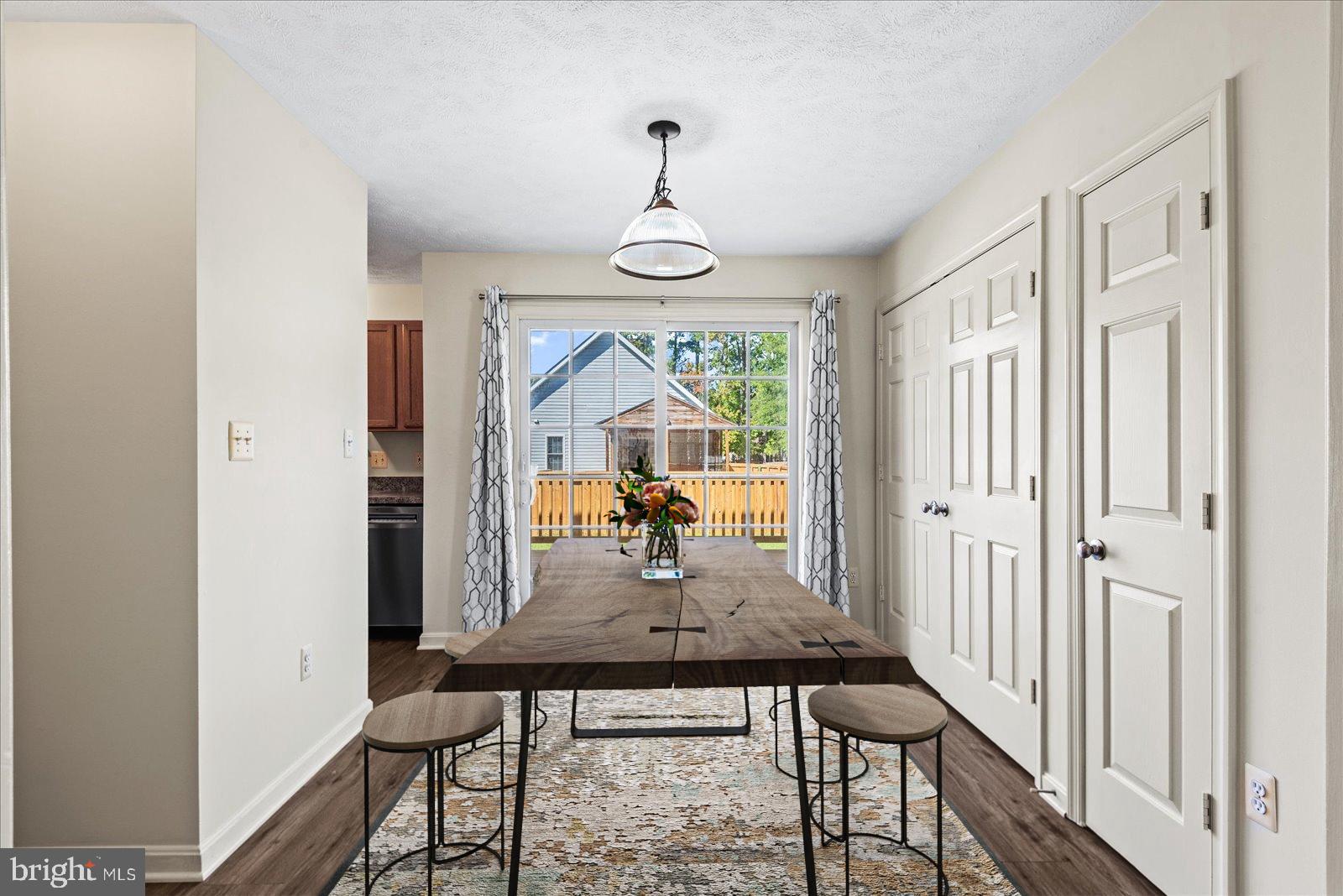 321 3rd Street Colonial Beach, VA 22443 - Photo 12 of 47 a dining room with furniture window and wooden floor