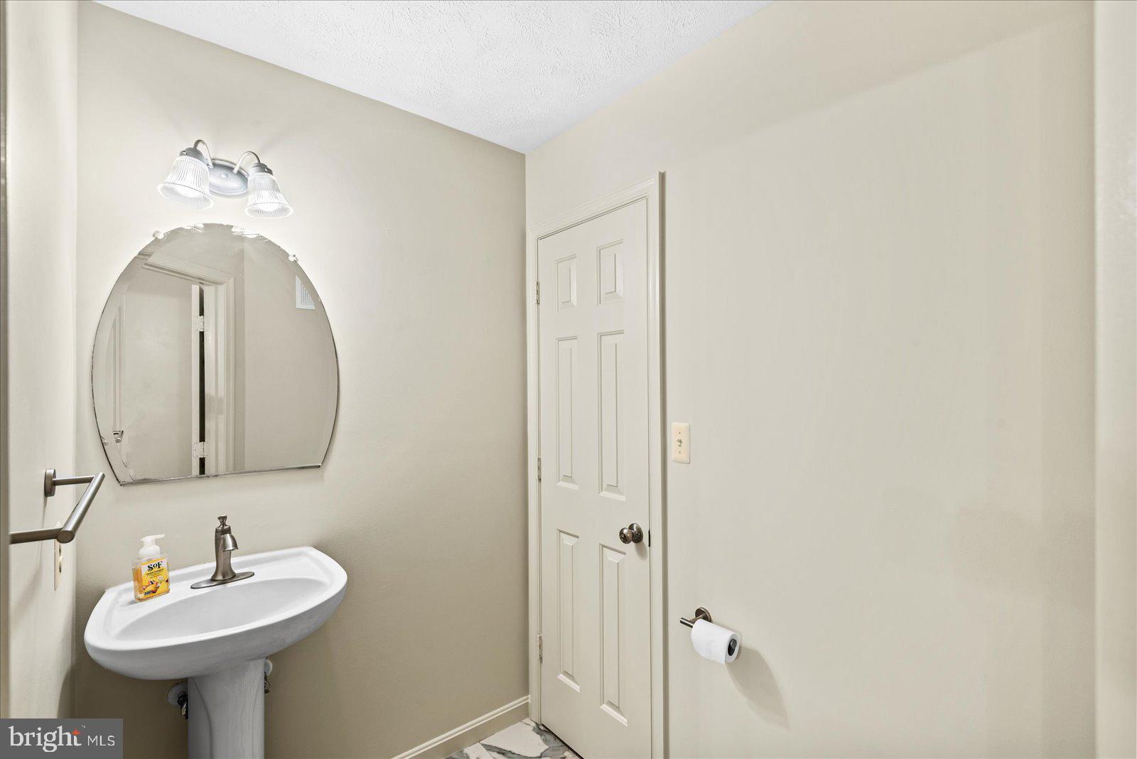 321 3rd Street Colonial Beach, VA 22443 - Photo 20 of 47 a bathroom with a sink and a mirror