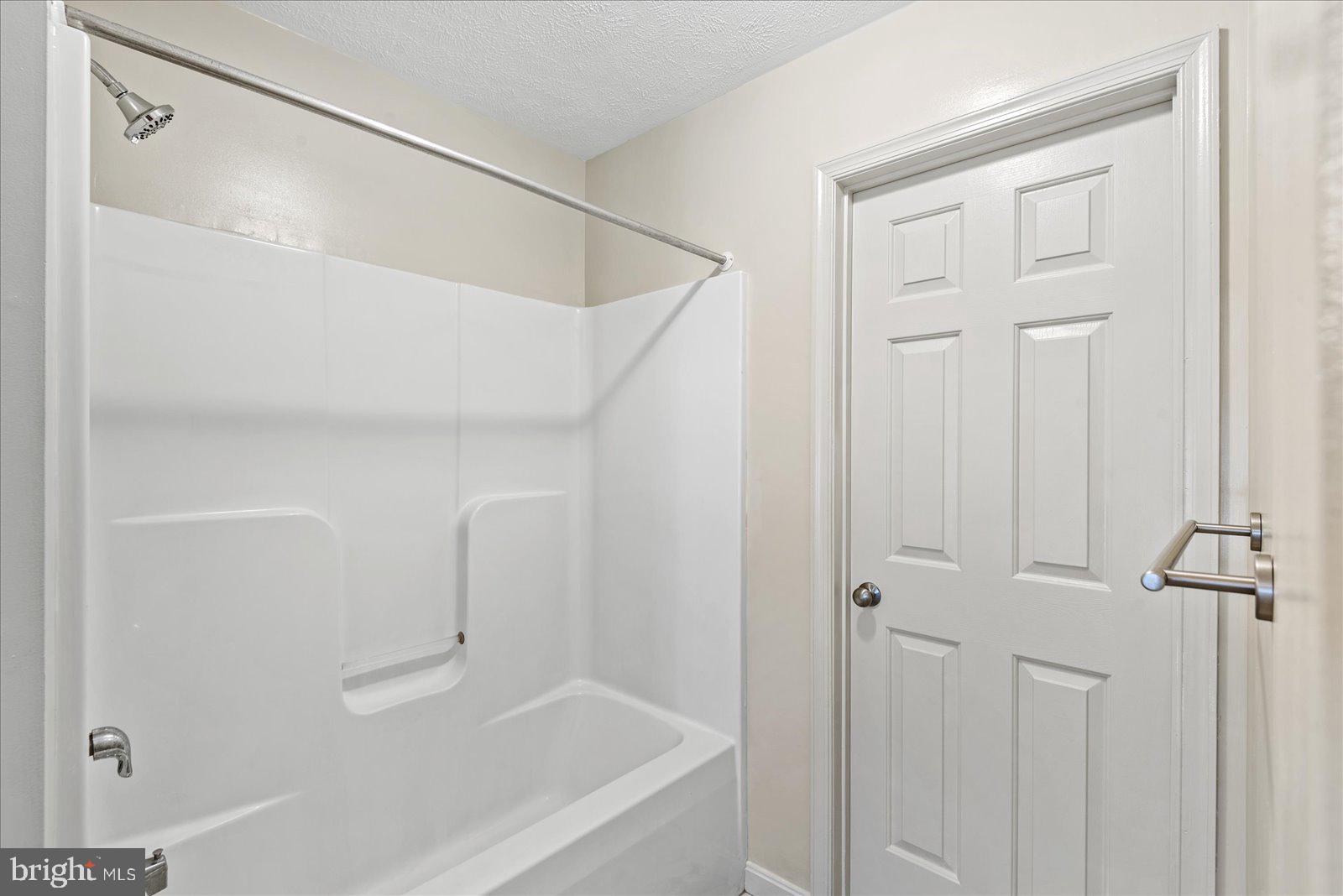 321 3rd Street Colonial Beach, VA 22443 - Photo 27 of 47 a bathroom with a bathtub