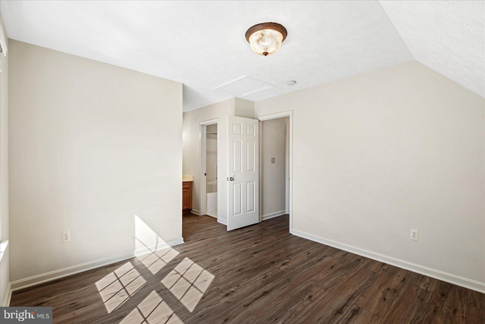 321 3rd Street Colonial Beach, VA 22443 - Photo 30 of 47 a view of a room with wooden floor and a ceiling fan