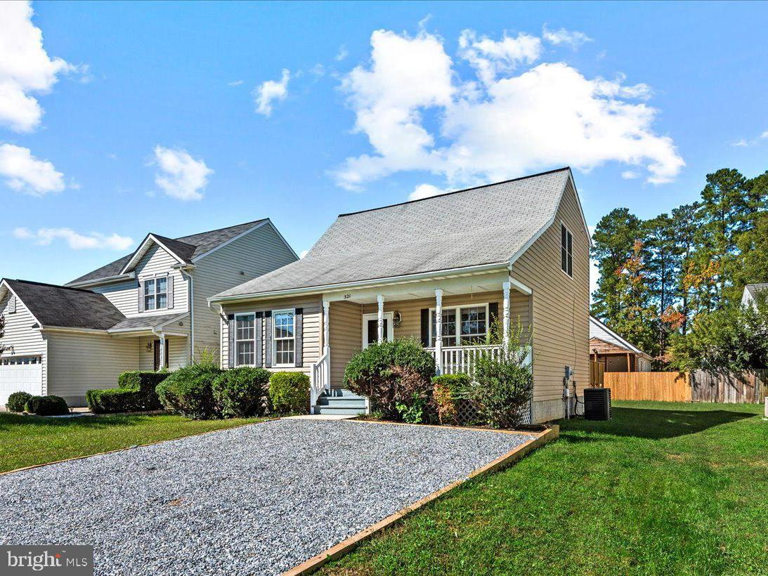 321 3rd Street Colonial Beach, VA 22443 - Photo 3 of 47 a front view of a house with garden
