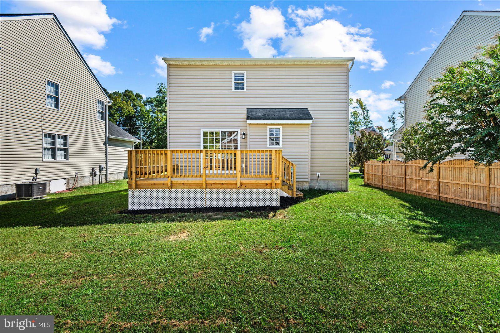 321 3rd Street Colonial Beach, VA 22443 - Photo 41 of 47 a view of a house with backyard and a garden