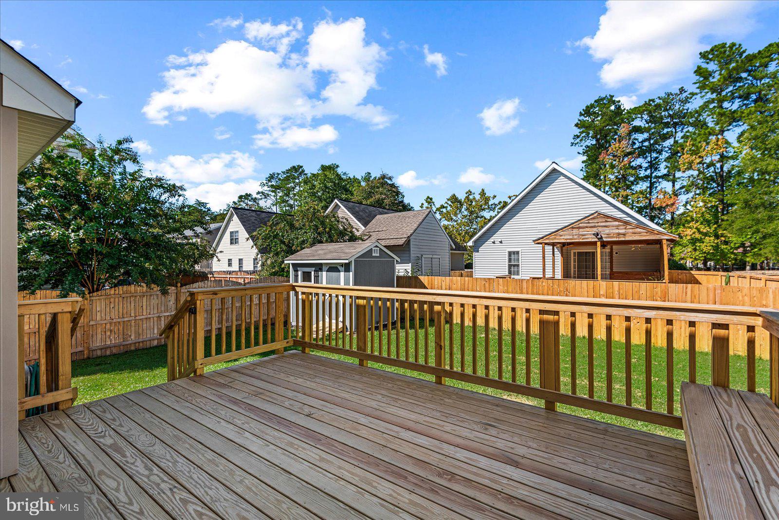 321 3rd Street Colonial Beach, VA 22443 - Photo 45 of 47 a view of a wooden deck and a yard