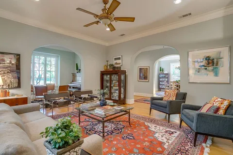 a kitchen with sink stove and cabinets