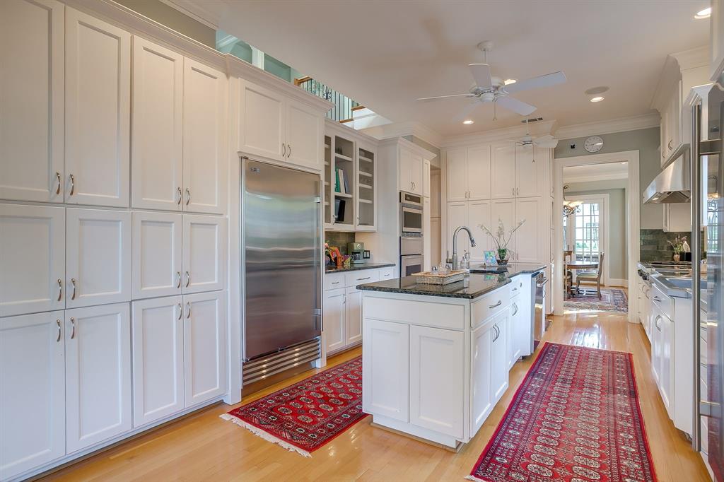 1620 Western Avenue Fort Worth, TX 76107 - Photo 19 of 40 a kitchen with stainless steel appliances granite countertop a refrigerator and a sink