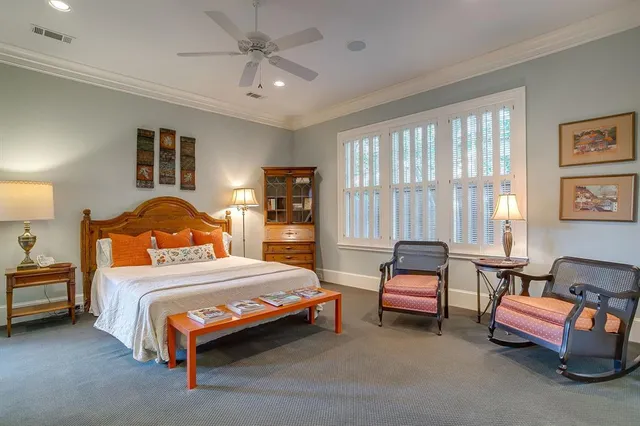 a bathroom with a granite countertop sink a mirror a bathtub and shower