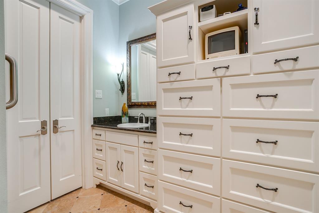 1620 Western Avenue Fort Worth, TX 76107 - Photo 28 of 40 a kitchen with white cabinets and microwave
