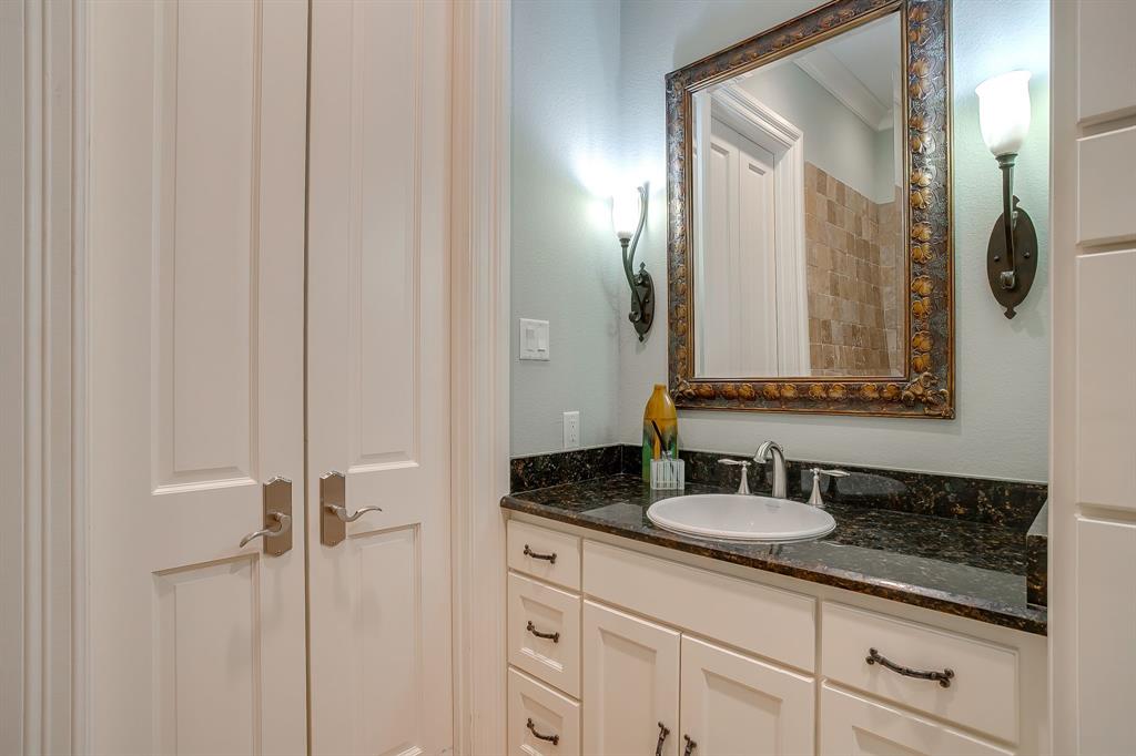 1620 Western Avenue Fort Worth, TX 76107 - Photo 29 of 40 a bathroom with a granite countertop sink and a mirror