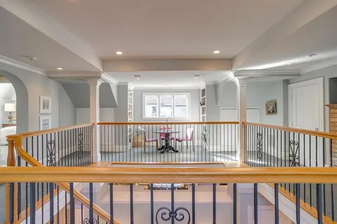 a bedroom with a bed couch and window