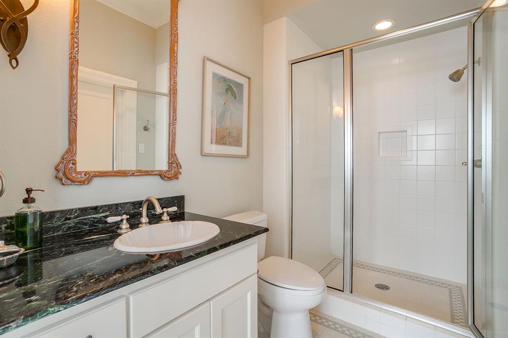 1620 Western Avenue Fort Worth, TX 76107 - Photo 35 of 40 a bathroom with a granite countertop sink toilet and shower