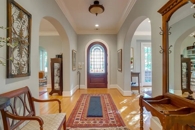 a view of a dining room with furniture and a chandelier