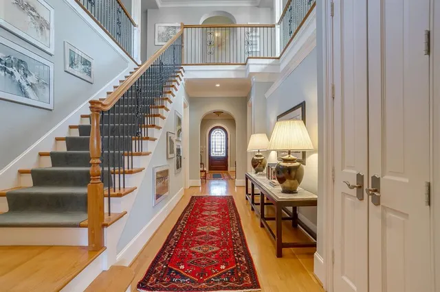 a view of a dining room with furniture wooden floor and a chandelier