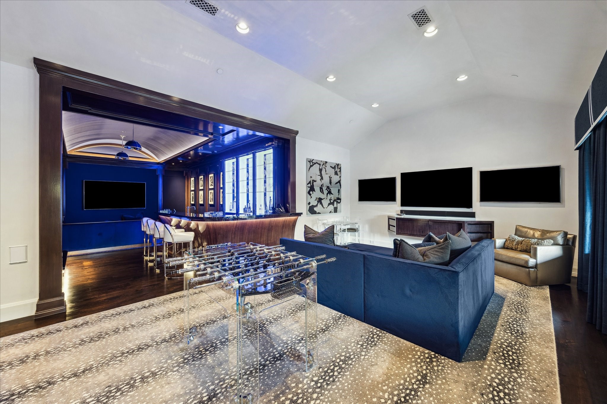 220 Merrie Way Lane Houston, TX 77024 - Photo 34 of 50 A sophisticated game room centered around a premium pool table and designer carpeting—ideal for relaxed gatherings and stylish entertainment.