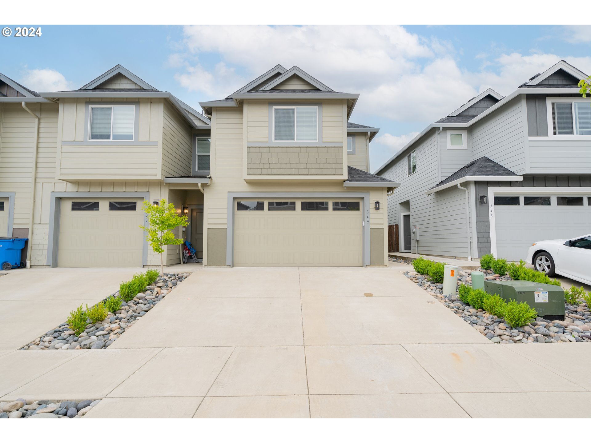 349 South 69th Place Ridgefield, WA 98642 - Photo 1 of 45 a front view of a house with a yard and garage