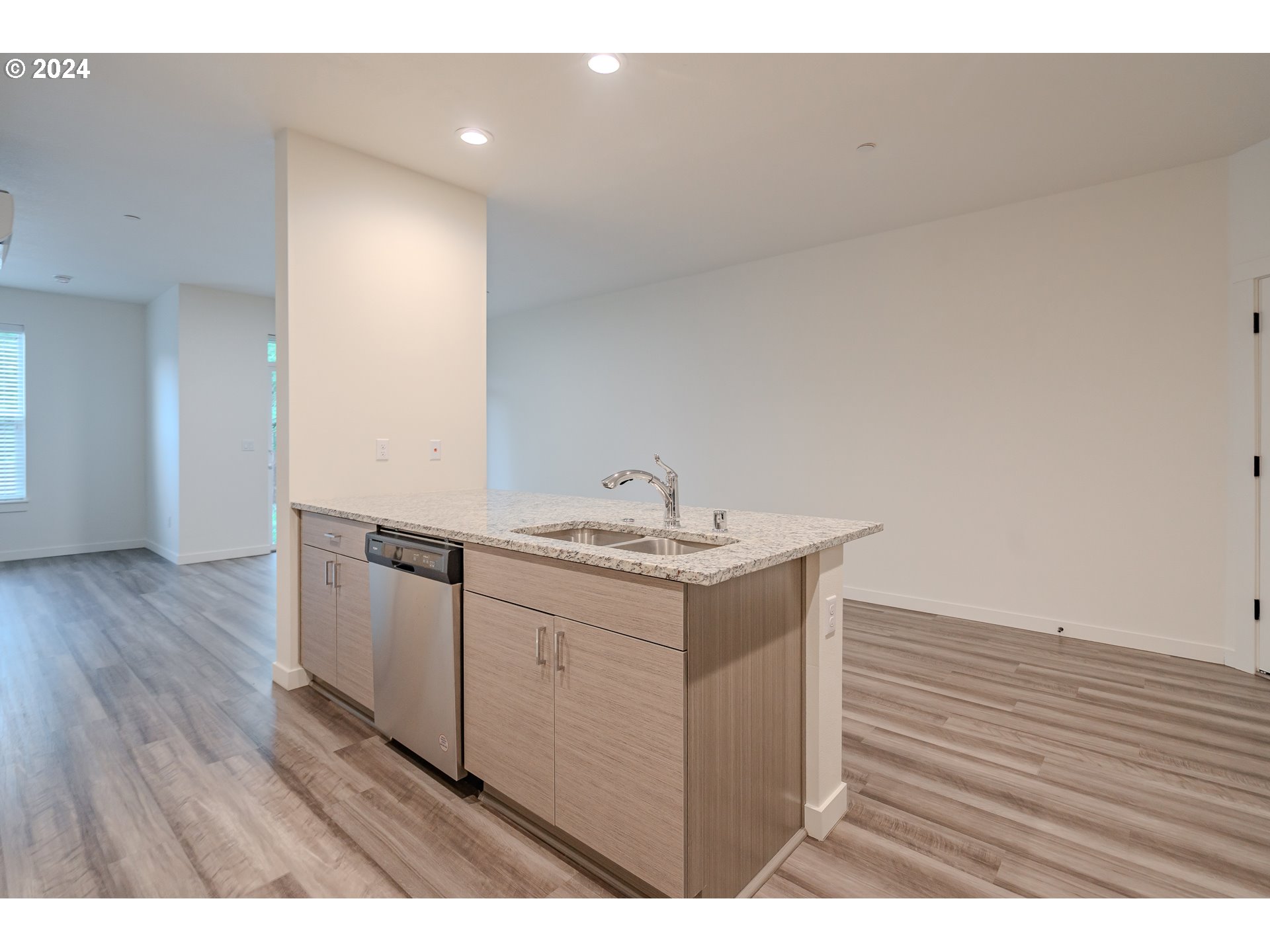 349 South 69th Place Ridgefield, WA 98642 - Photo 11 of 45 a kitchen with a sink cabinets and wooden floor